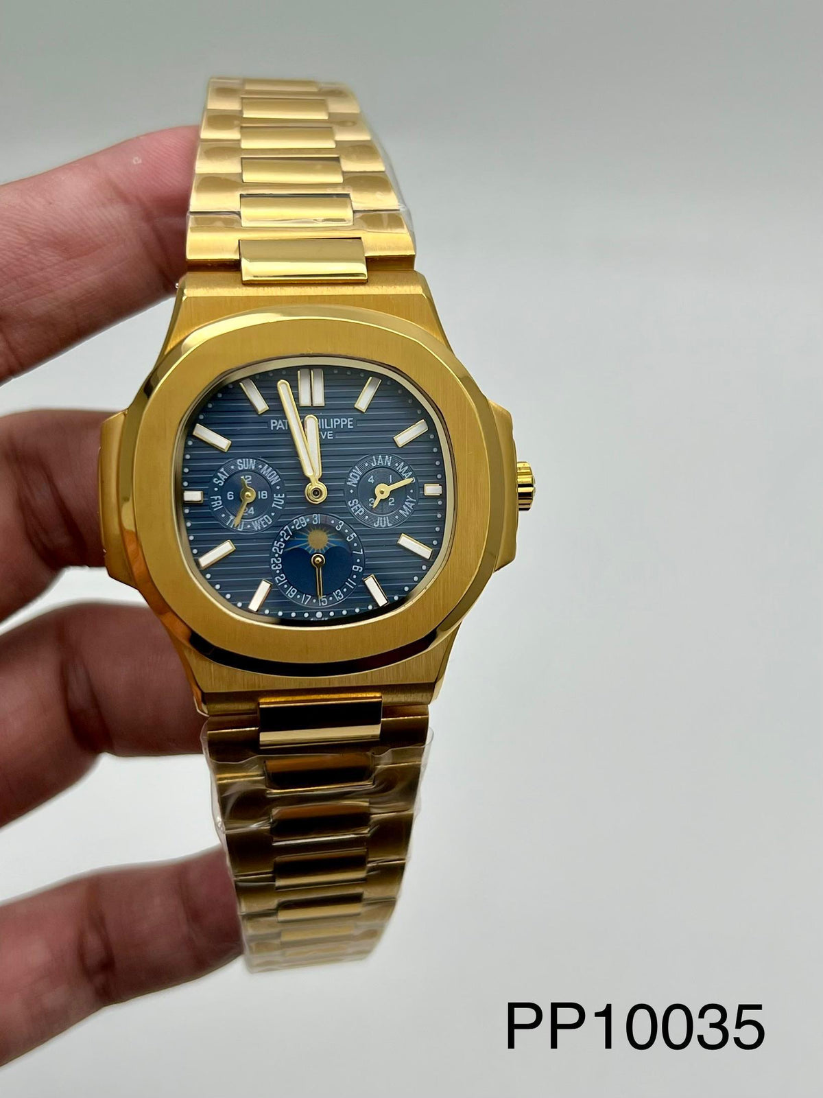 NAUTILUS || 5740 || GOLD || SUNBURST BLUE DIAL